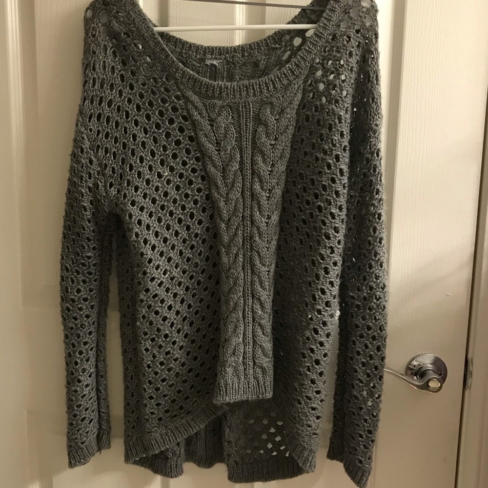 Grey cable knit sweater with crochet details